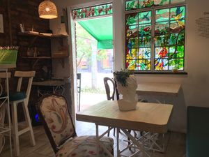 There are five tables inside and I think a couple outside   at Iom Cocina Plant-Based in Bogota