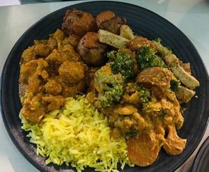 Butter chicken, chickpea satay, koftas with satay sauce and tofu, broccoli. sweet potato salad   at Govindas in Coolangatta