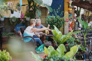 customers enjoying drinks and a talk  at Lá Veg in Hoi An