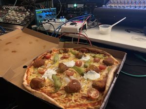 Falafel pizza to go. March 2020   at Deli Italia Södermalm in Stockholm