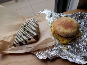 Blueberry lemon scone and Mickey G breakfast sandwich. at Grindcore House - West Philly in Philadelphia