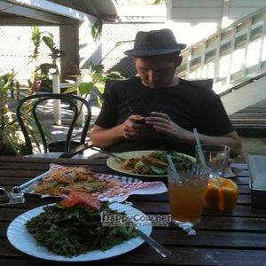 My fiance and his vegan BLT, animal liberation fries and my huge salad! at Garden to Grill in Sacramento