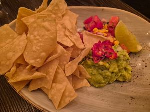Guacamole $19.00: lovely crispy corn chips, not huge taste, the pico de gallo was bland, tomatoes used were floury at Vandal in Newtown