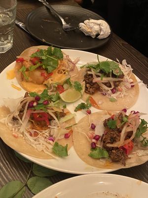 Popcorn shrimp taco (top left), lamb tacos (left and bottom), and the duck carnitas taco (right)  at Vandal in Newtown