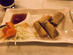 Fried veggie rolls (what’s left of them before I remembered a picture) - SO good!  at Chalerm Thai Bistro in Lakeport