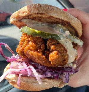 Mother Clucker: Nashville hot chicken, pickles, slaw, sauce  at Peach and Pine in St James