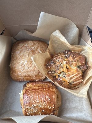 Kouign amann, sausage and cheese pull apart, pepperoni pizza roll  at Peach and Pine in St James