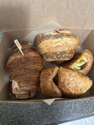 From left: BLT on a croissant, BEC croissant, 2 ham and cheese croissants, chicken parm muffinns  at Peach and Pine in St James