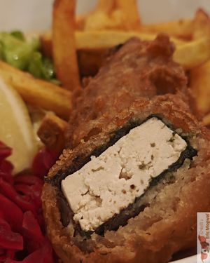  a marinated tofu fritter with home fries and lacto-fermented red cabbage with a homemade tartar sauce at Dis Leur in Bordeaux
