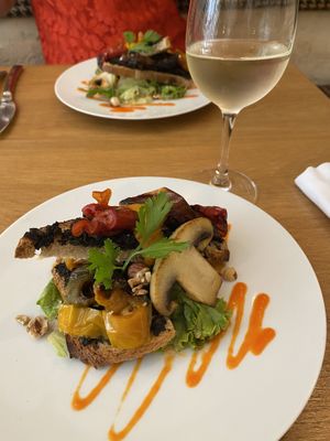 Crostini entrée with roasted peppers, mushrooms and tapenade. at Dis Leur in Bordeaux