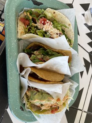 Left to right: Breakfast potato taco, veggie taco, plantain taco, fried avocado taco  at Tacotarian - Downtown LV in Las Vegas