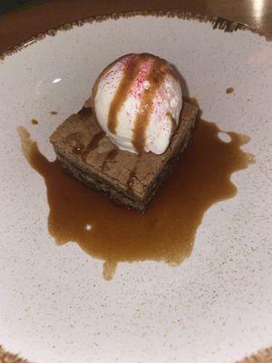 Cookie dough blondie with caramel sauce and vanilla ice cream  at Shrub in Chester