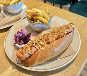 Hot-dog with a tasty grilled sausage, a serving of fries and some red cabbage slaw. Really nice!  at Shrub in Chester