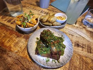 Top left to bottom: teriyaki tofu, frickles, potato terrine. at Shrub in Chester
