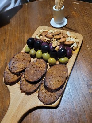 Plant-based sausages, olives & mixed Nuts at Living Vino @ So Lucky Bar in Tbilisi