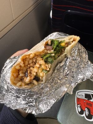 7€ for this burrito : rice, tofu, chili sauce, tomato, corn, coriander and guacamole (additional fees for the guacamole)   at Cuchara - Hapjeong Station in Seoul