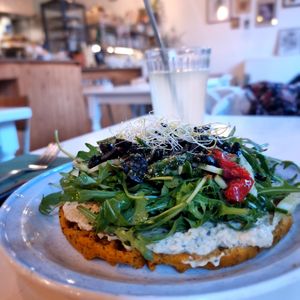 Sweet potato waffle with hummus and rucola etc on top at CLO in Antwerpen