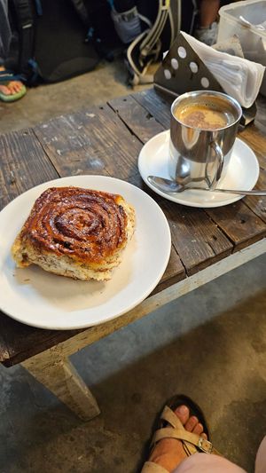 Coconut milk masala chai and cinnamon roll at Café Moktan and Bakerys in Rishikesh