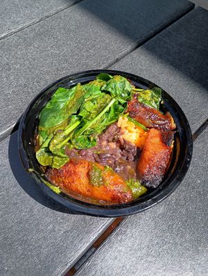 Vegan bowl with yellow rice, black beans, plantains, spinach and chimichurri at Rum Cake Lady in Blue Ridge