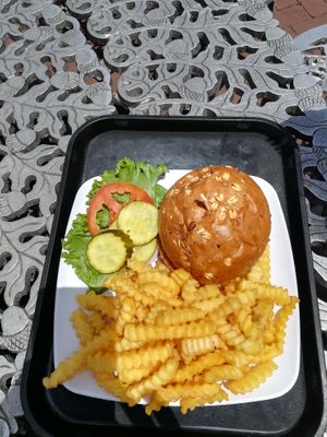 Vegan burger with fries at Statue of Liberty Crown Cafe in New York City