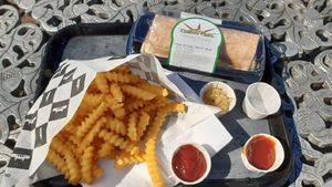 Fries and avocado bacon(tofu) wrap at Statue of Liberty Crown Cafe in New York City