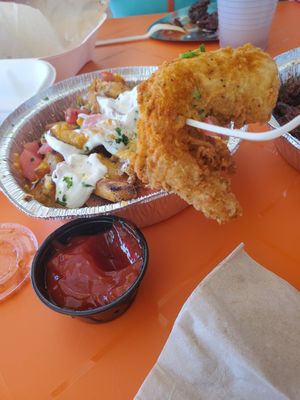 Jumbo prawns and fully loaded fries at The Rabbit Hole in Pompano Beach
