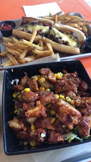 Bbq chicken salad (freedom salad?) and Philly cheesesteak !  at The Rabbit Hole in Pompano Beach