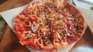 Pizza. It's a bit small to have it by itself but a good size for sharing between 2 people as a side. at Holy Holy Familiar Tree Cafe in Ikeda