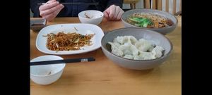 Fried noodles, Dumplings and mushrooms and noodles in broth (all vegan). We'd already started eating the fried noodles here so portion was bigger than this!  at Qibao Temple in Shanghai