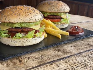 100% Plant-based burger with chipotle ketchup.

Mexican Vegan Burger with vegan cheese, guacamole, salad, and tomato! at Cactus Jack in Nyon