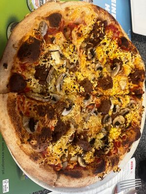 Build your own with vegan cheese, mushrooms and beyond meat  at Pizza Mann in Innsbruck