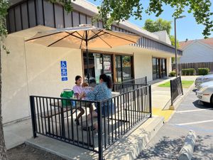 They set up this umbrella for us to sit outside  at Pizza Riot in Chico