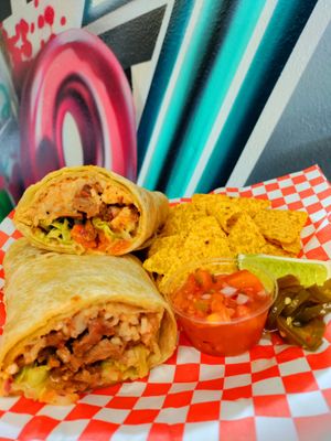 Weighing in at about 2lbs, this is not your ordinary vegan burrito! This carne asada burrito is full of flavor and will satisfy your fiercest cravings!  at Pizza Riot in Chico