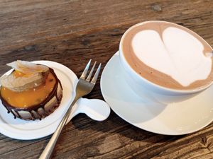 chocolate maracuja mini cake and oat milk cocoa at Sarah's Konditorei & Cafe in Koenigswinter