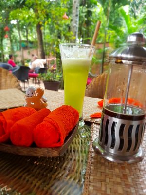 Green goddess juice and peppermint scented towel at Peace Cafe in Siem Reap