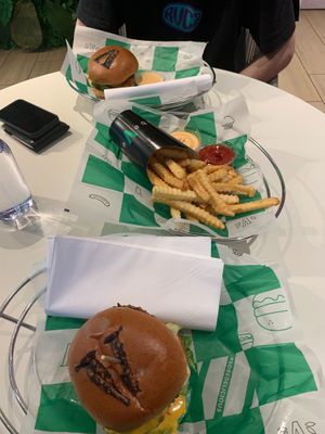 Sobe stack closest to camera, fries in the middle, and classic chick’n furthest from camera  at SoBe Vegan in Fort Lauderdale