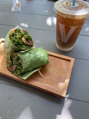 the burger wrap! so good. great sauce. also iced coffee w soy milk  at SoBe Vegan in Fort Lauderdale