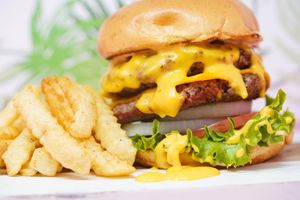 Double stacked burger with fries at SoBe Vegan in Fort Lauderdale