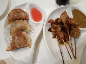 Pan fried dumplings and satay chicken scewers at Easy House in Gold Coast