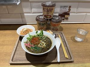 The black sesame ramen set and 3 cup noodles they sell at the restaurant  at T's Tantan - JR Ikebukuro in Tokyo