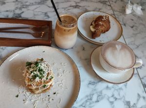 Lasagna, cherry ice latte, banana almond butter croissant, cocoa at Veg Harmony in Minsk