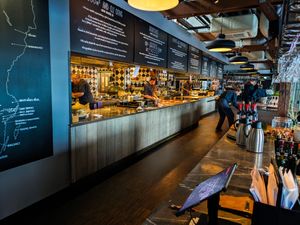 The kitchen, and part of the inside of the very large dining area at Fotografiska -- all with really nice design at Fotografiska in Stockholm