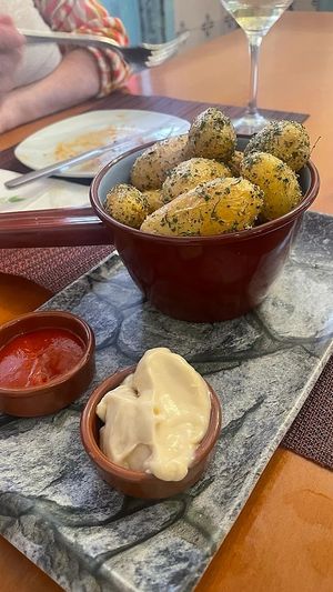 Patatas asadas, mayonesa no vegana.  at Tatapas Gastroteka in Hondarribia