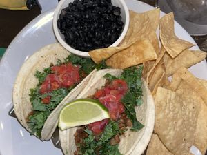 Seitan tacos with black beans and chips  at Kale My Name in Chicago