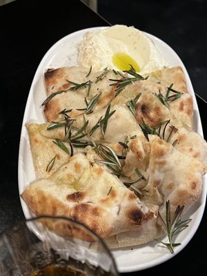 FOCACCIA AL ROSMARINO $18.00
Focaccia bread with rosemary and E.V.O.
served with a side of whipped feta and smoked salt flakes. 2 serves of this for table of 4 in banquet!   at Nonna's Nightmare in West End