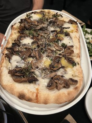 MAGIC MUSHROOM $27.00
Mozzarella, Seasonal mix roasted mushrooms, trutte cream & lemon thyme (our other pizza option choice from the banquet menu) 
  at Nonna's Nightmare in West End