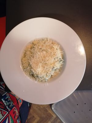 Potato gnocchi in plant based cream spinach sauce topped with vegan parmegio.  at The Street  in Prague