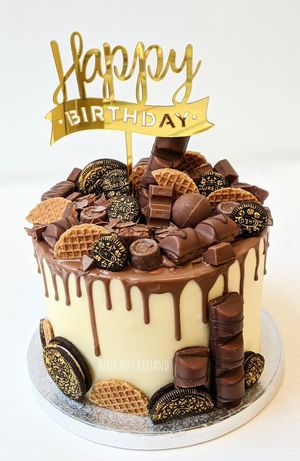 Chocolate & caramel candy drip cake. at Alice in Cakeland in Rotterdam