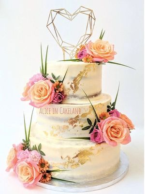 Spring royal wedding cake - Naked cake with 24k edible gold leaf details and fresh flowers. at Alice in Cakeland in Rotterdam