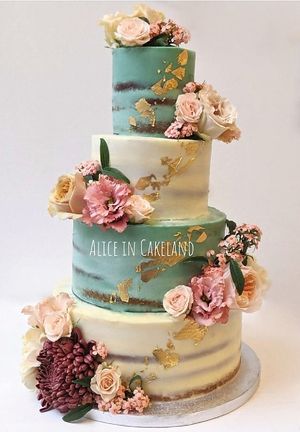 Vintage royal wedding cake - Naked cake with 24k edible gold leaf details and fresh flowers. at Alice in Cakeland in Rotterdam